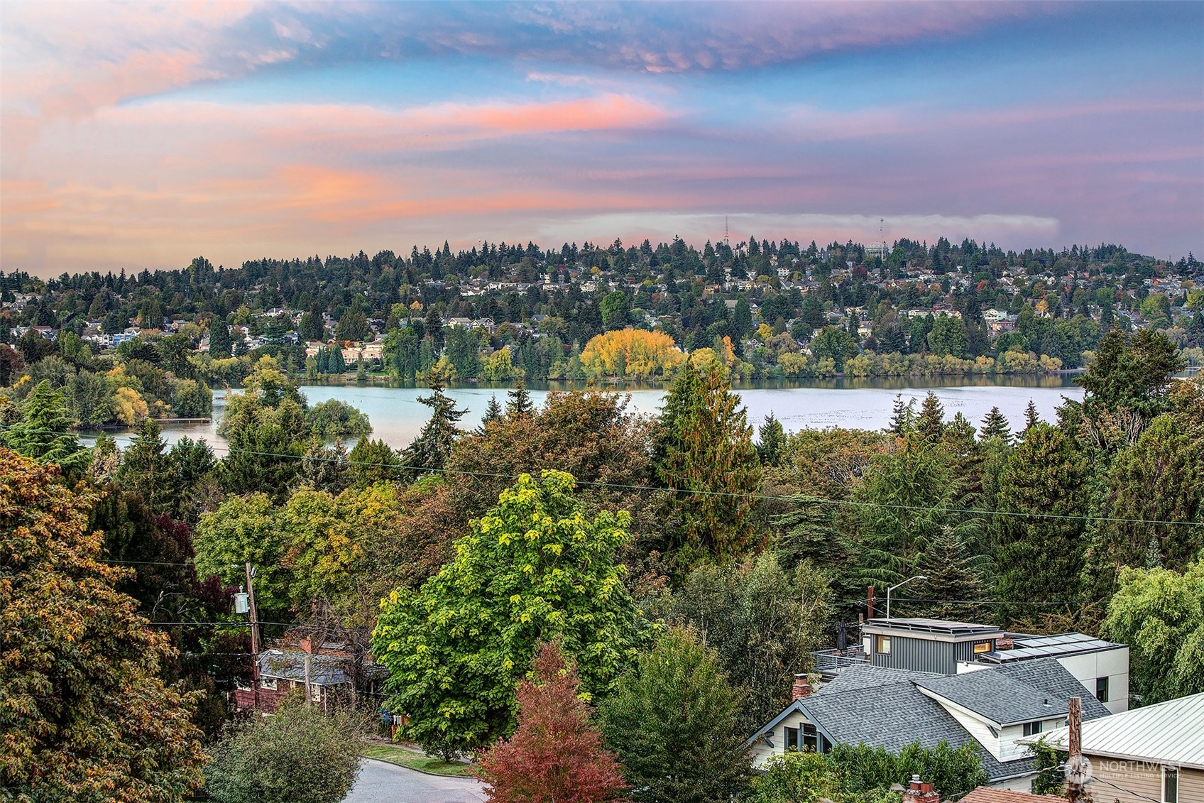 an aerial view of a house with a lake view