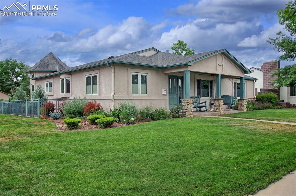 a front view of house with yard and green space