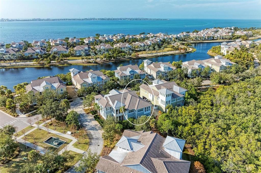 an aerial view of a house with a ocean view