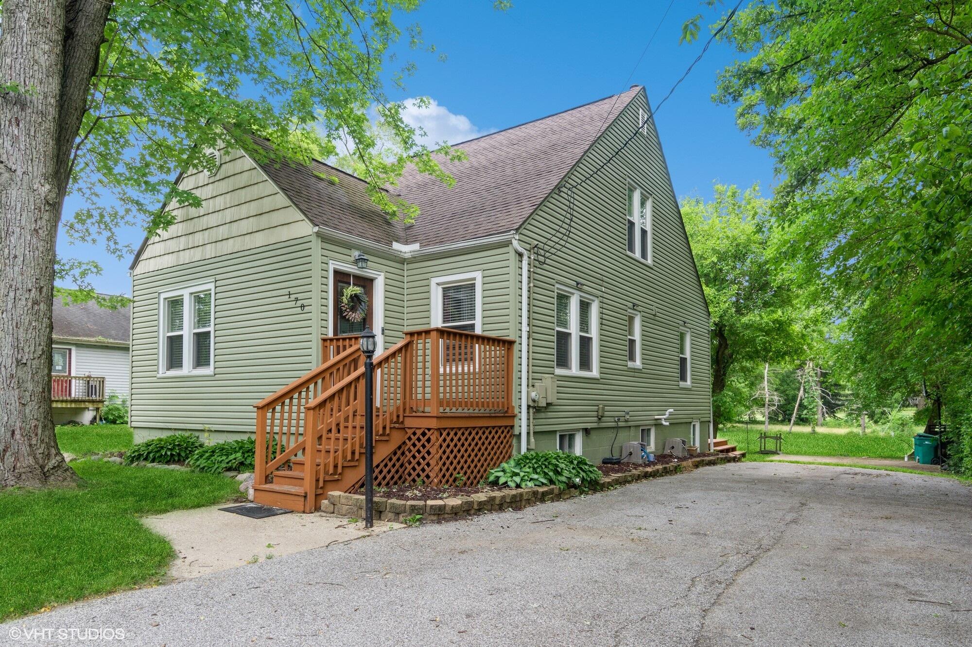 a view of a house with a yard and plants