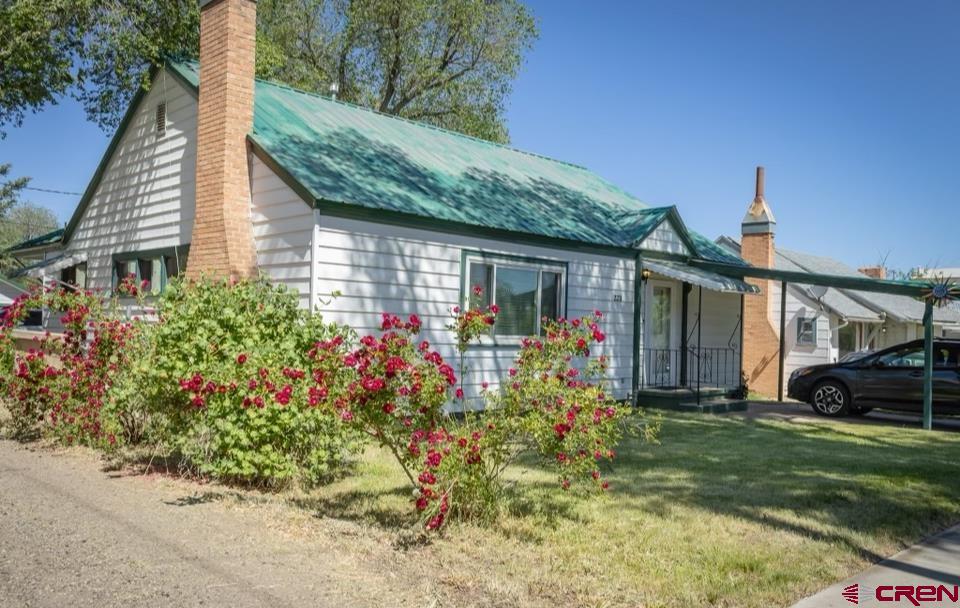 a front view of a house with garden