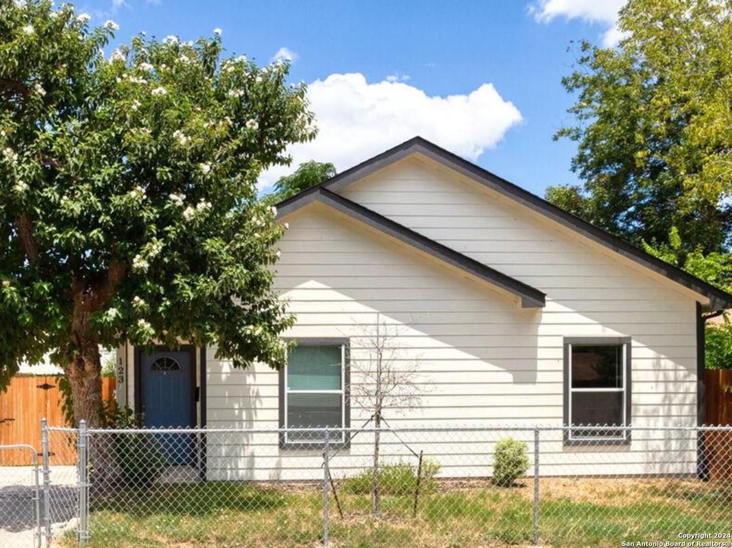 a house with a tree in the background