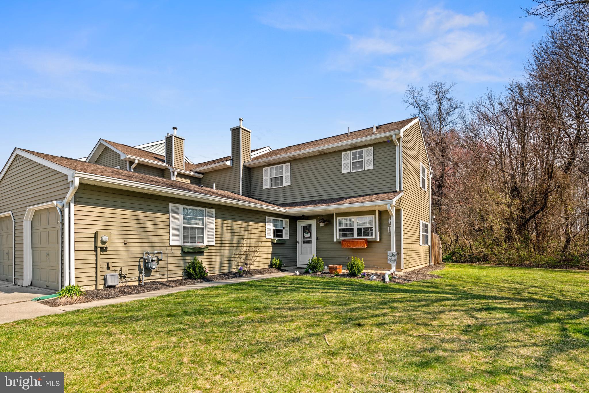 a front view of house with yard outdoor seating and barbeque oven