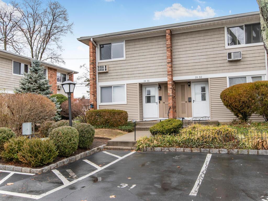 View of front of home. Assigned spot in front of unit.