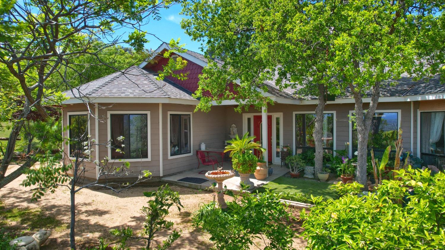 a front view of a house with garden