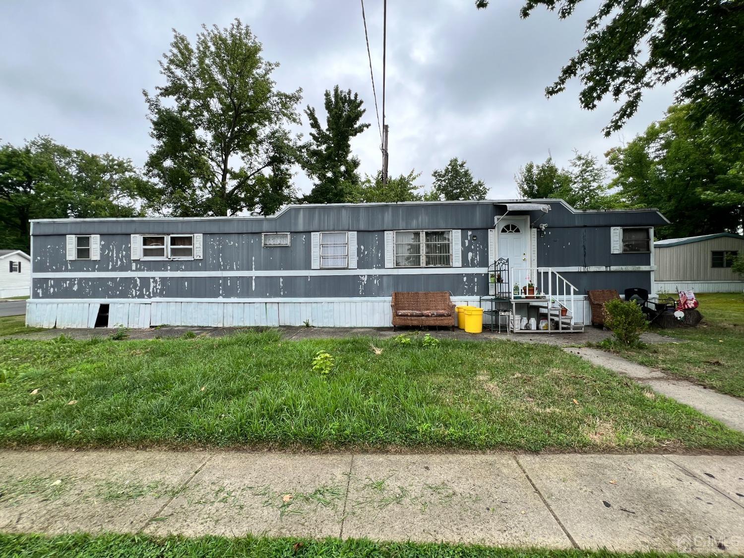 a front view of house with yard and seating area