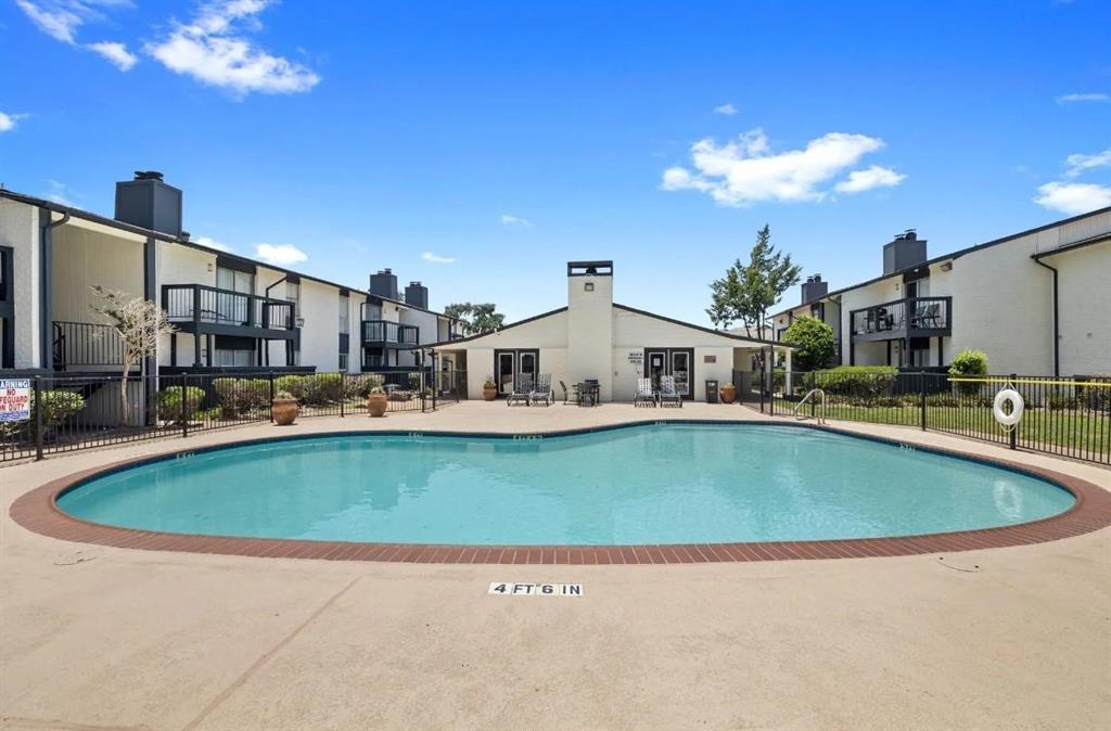 a view of swimming pool with outdoor seating