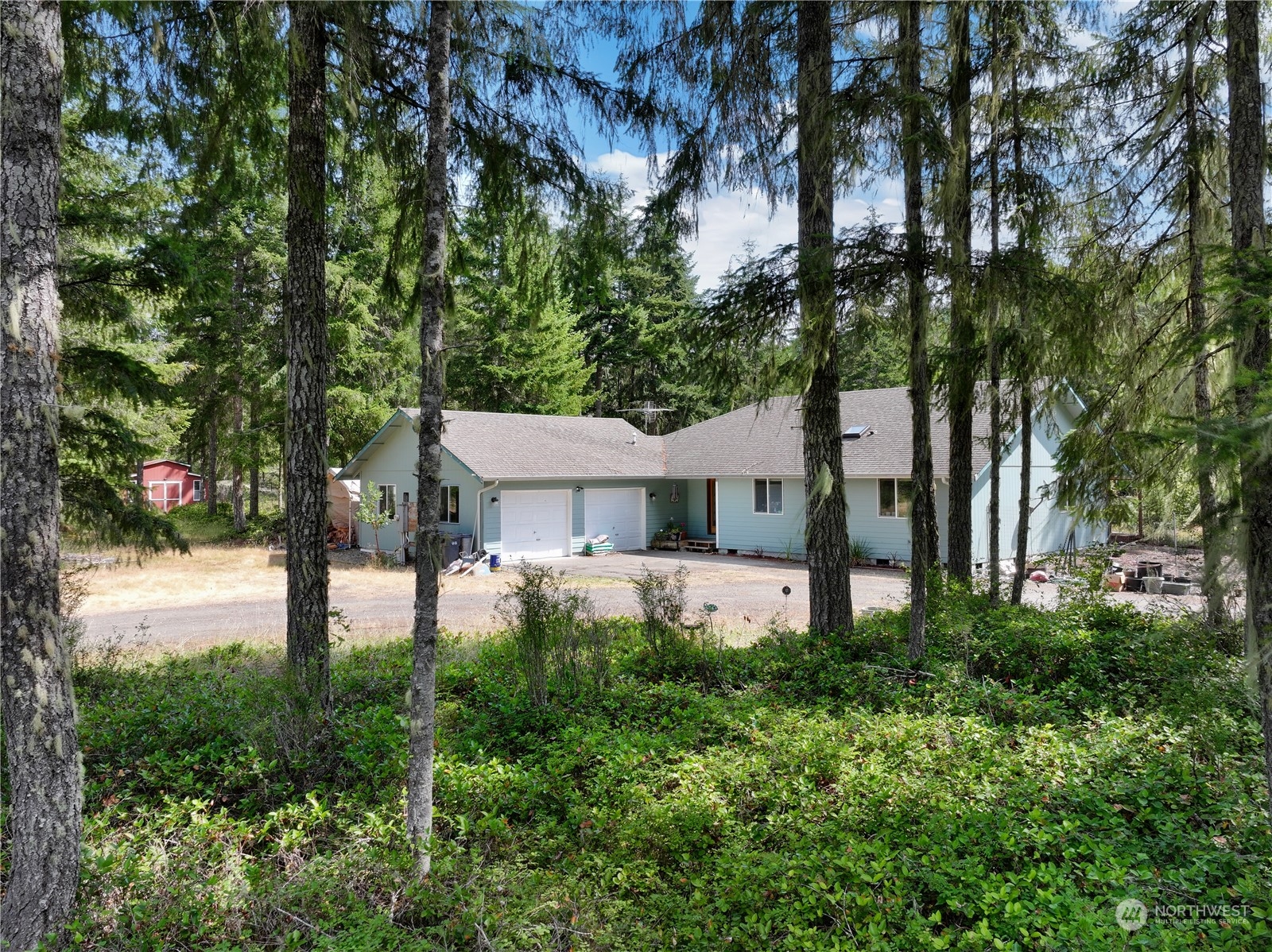 a view of a house with a yard and tree s