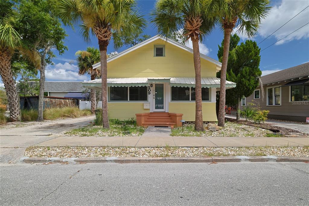 front view of a house with a small yard