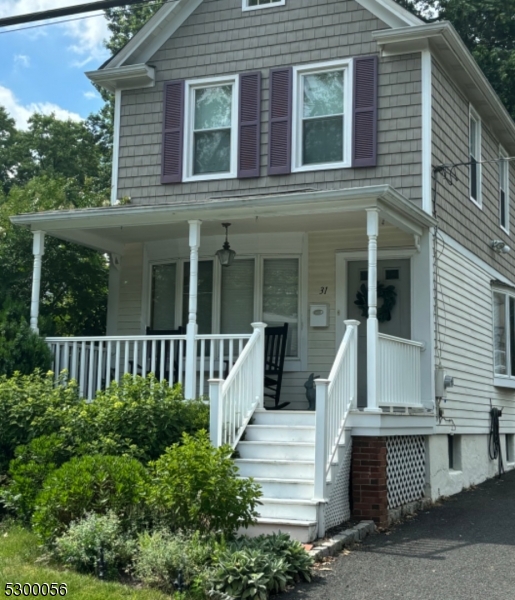 a view of a house with a window and stairs