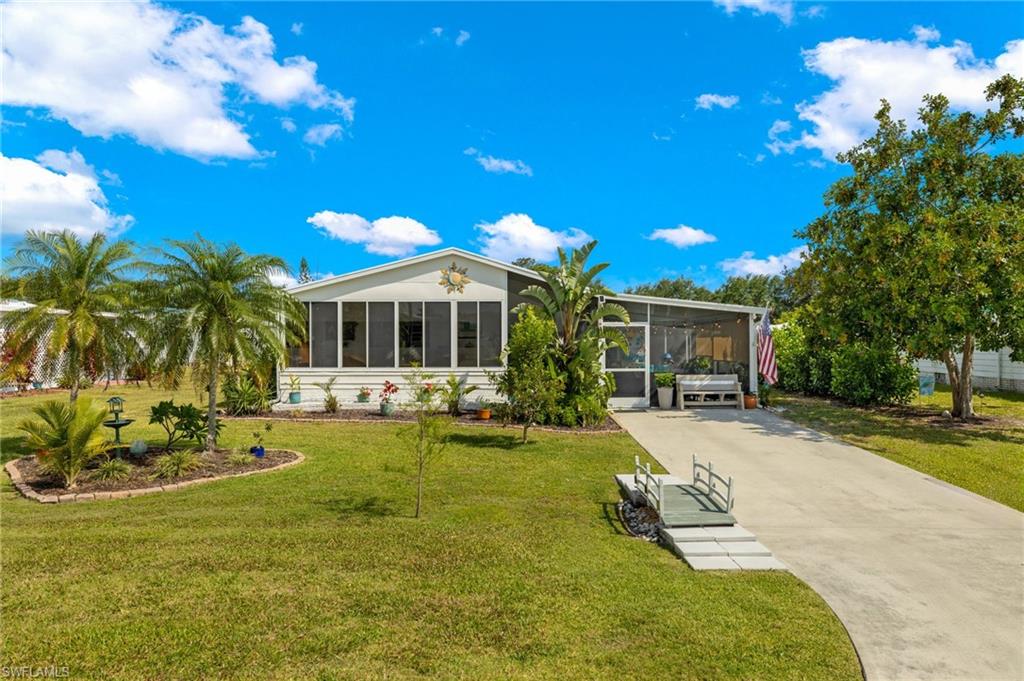 a view of a house with swimming pool and sitting area