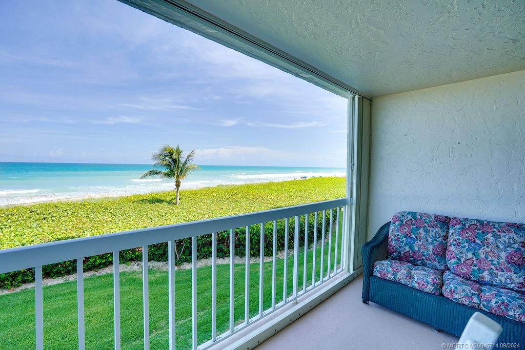 a view of a living room and a balcony