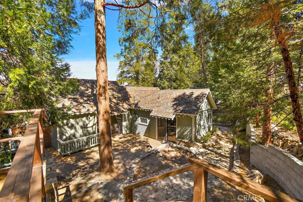 a view of a house with a tree