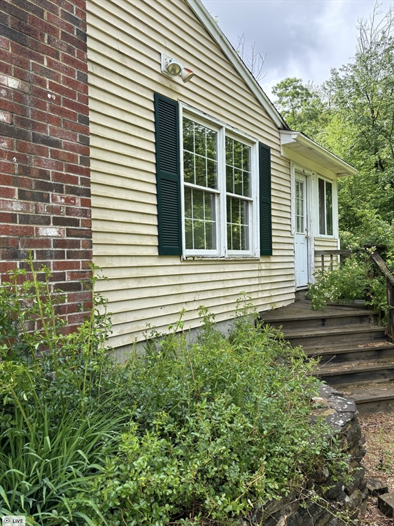 a view of a house that has a small yard