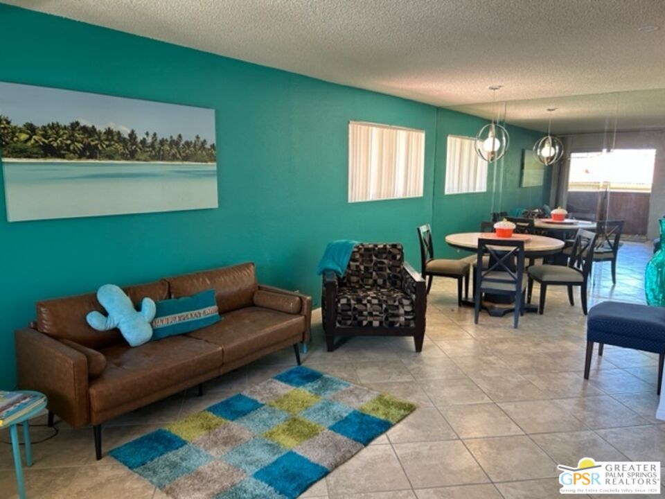 a living room with furniture and a rug