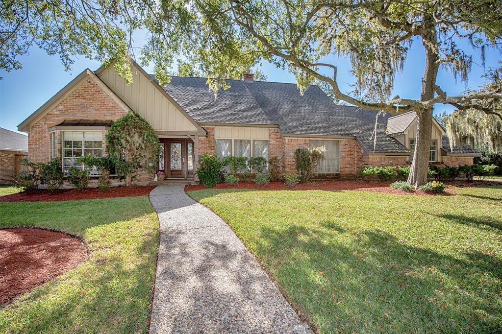 The front of this home is an impressive sight, with its stately architecture and well-manicured landscaping.  This home has an amazing backyard that includes a gorgeous pool.