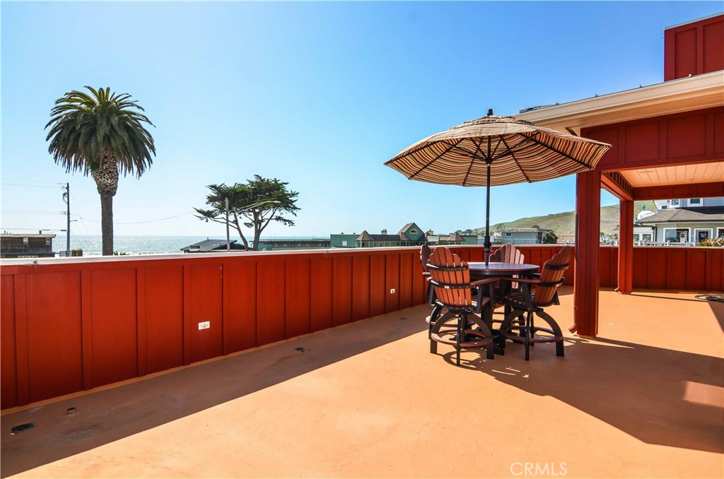 an outdoor space with furniture and umbrella