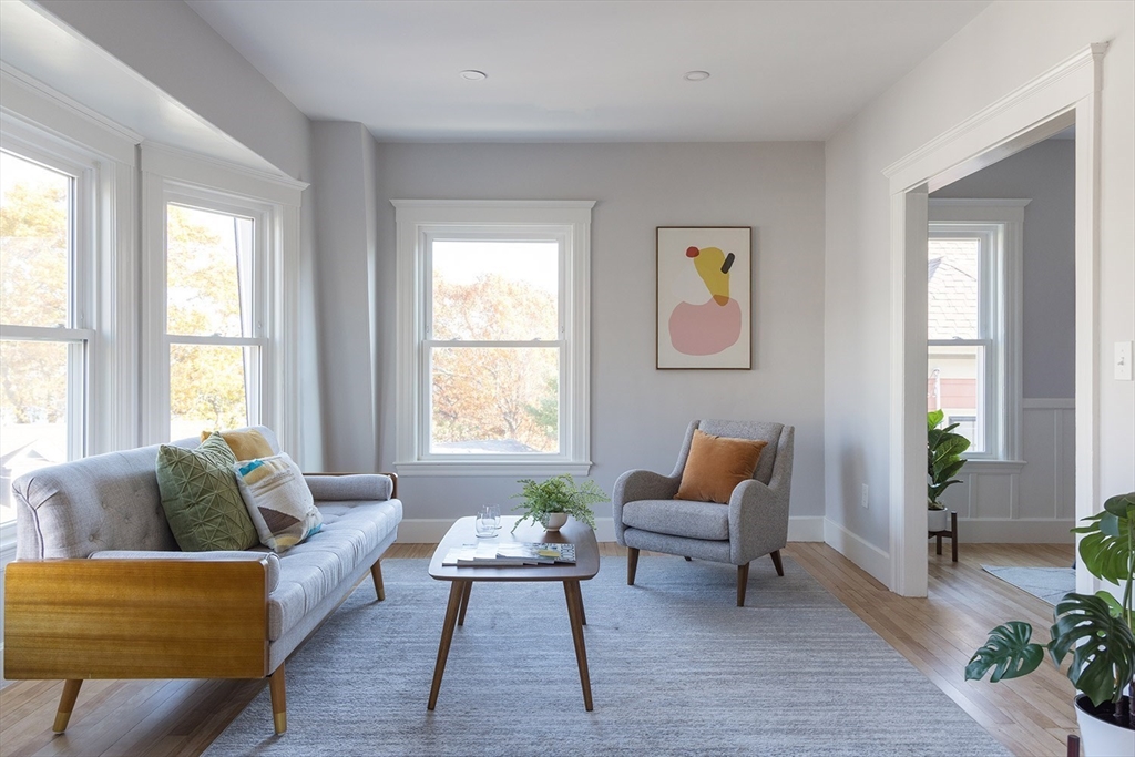 a living room with furniture and windows