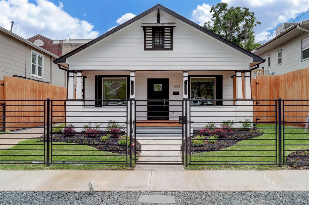 a front view of a house with a small yard