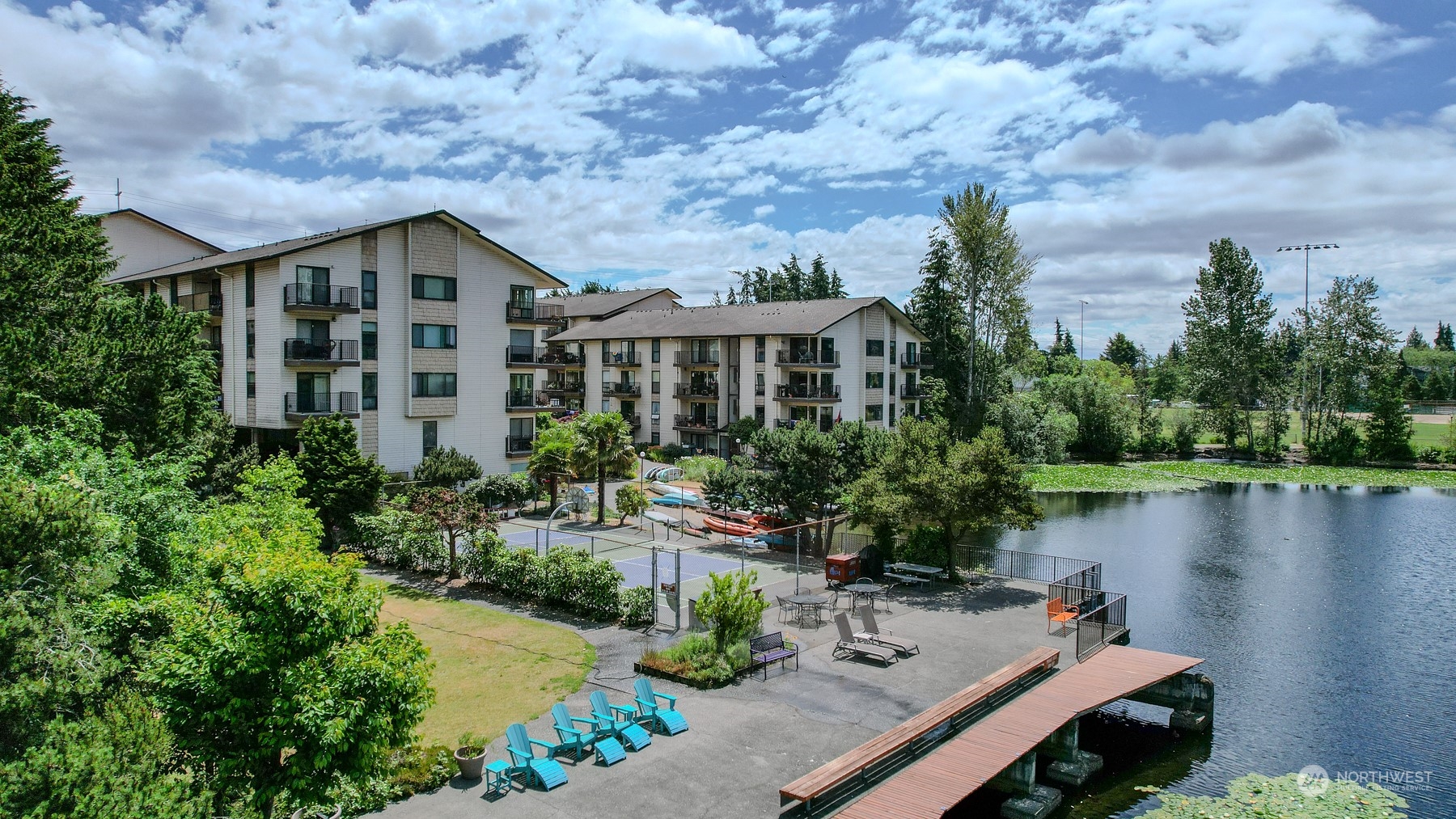 an aerial view of a house with outdoor space and lake view