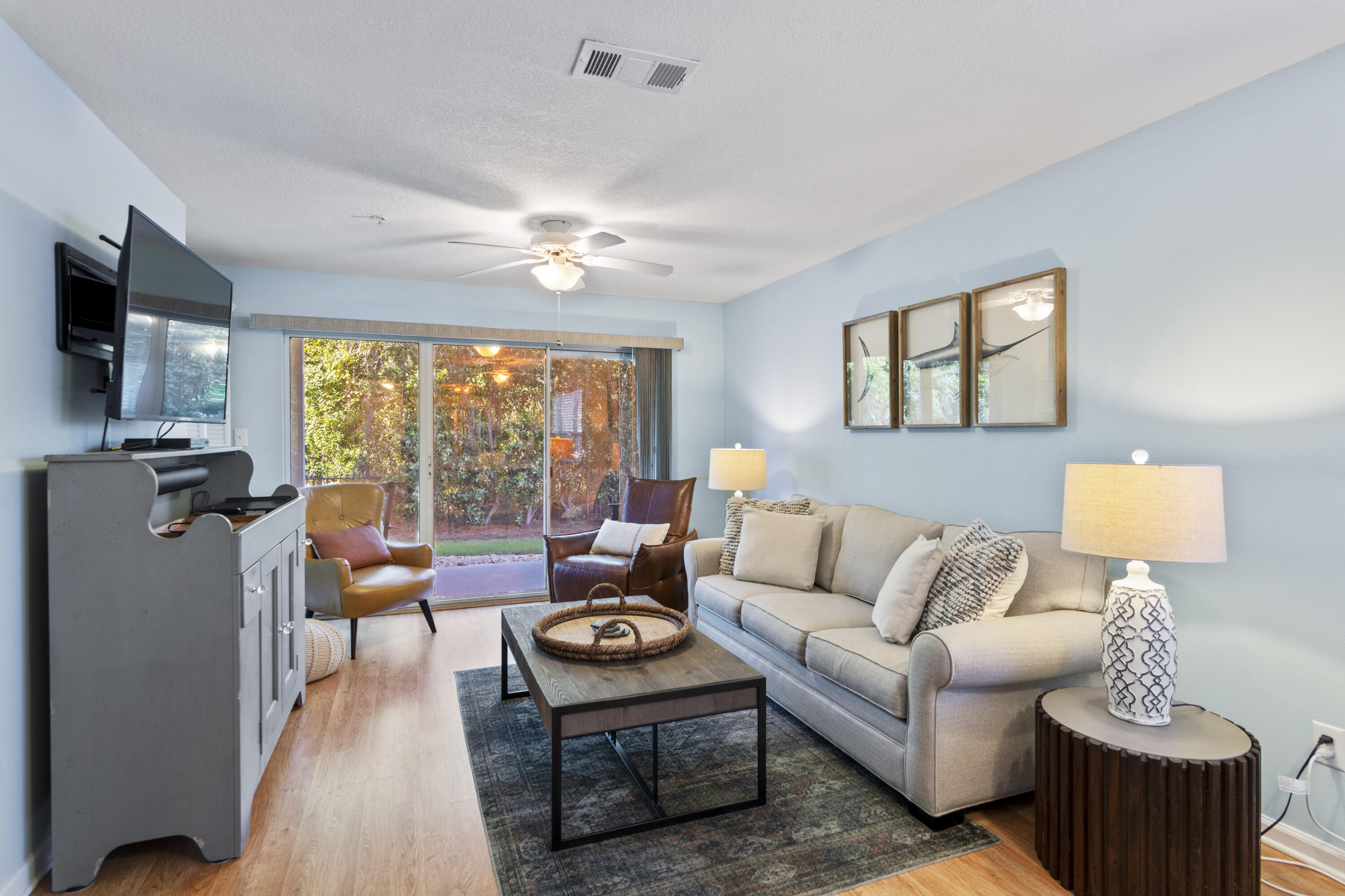 a living room with furniture and a flat screen tv