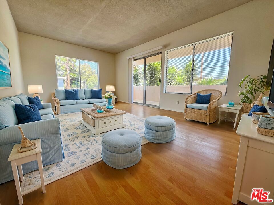 a living room with furniture and a large window