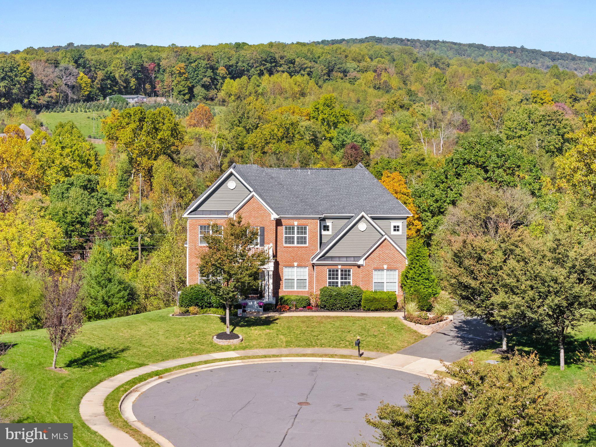 a view of an house with a big yard