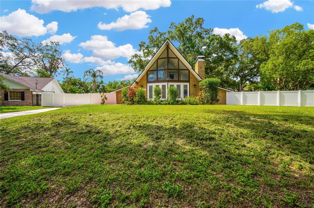 a view of a house with a yard