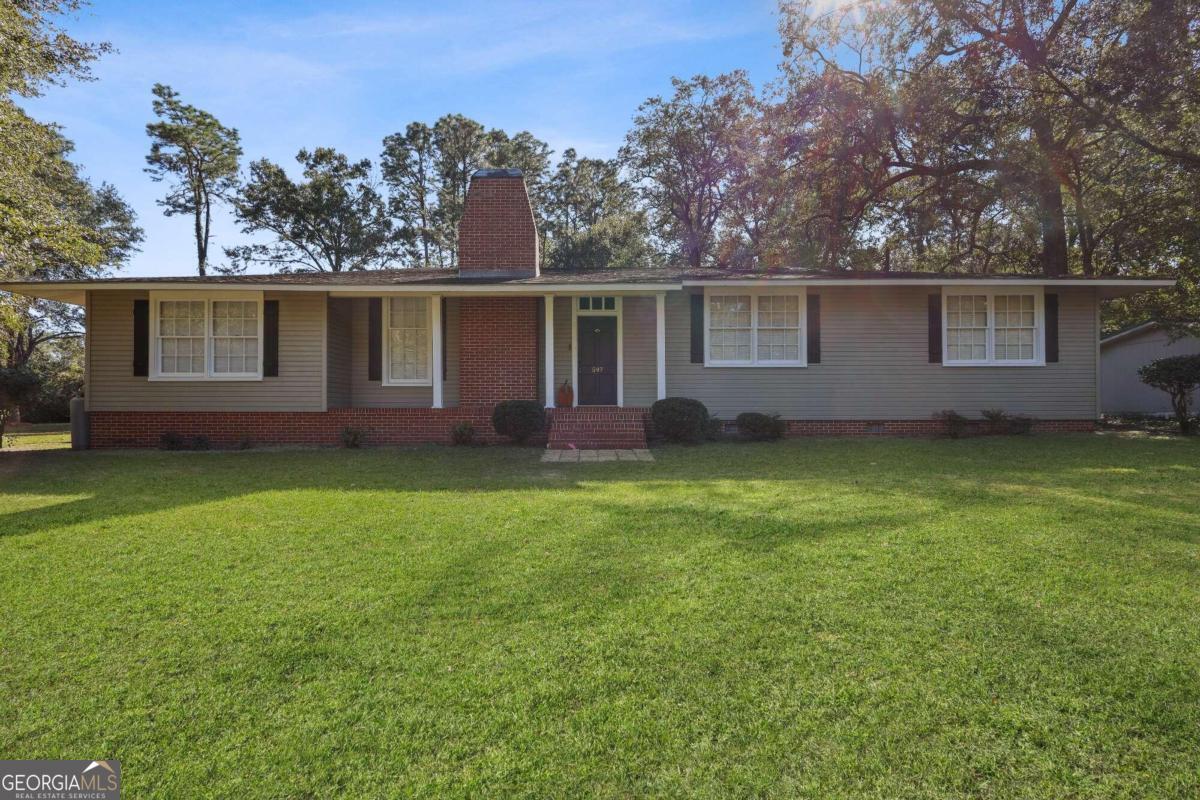 front view of a house with a yard