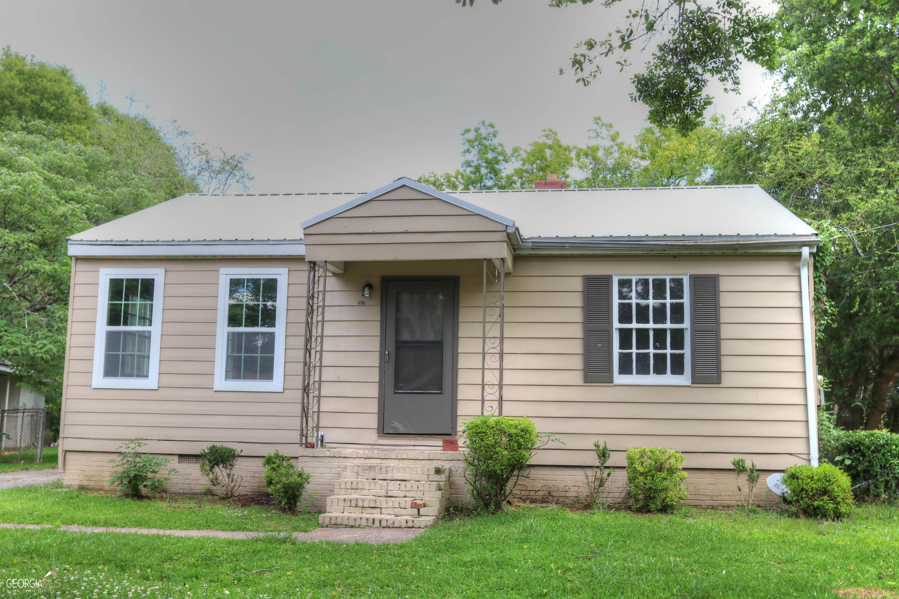 a front view of a house with a yard