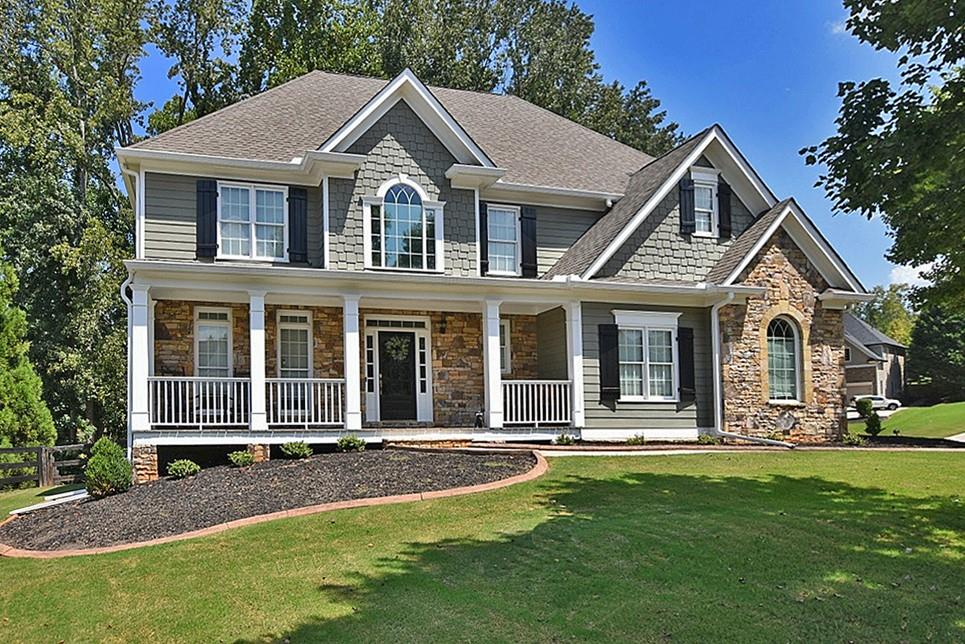 a front view of a house with a yard