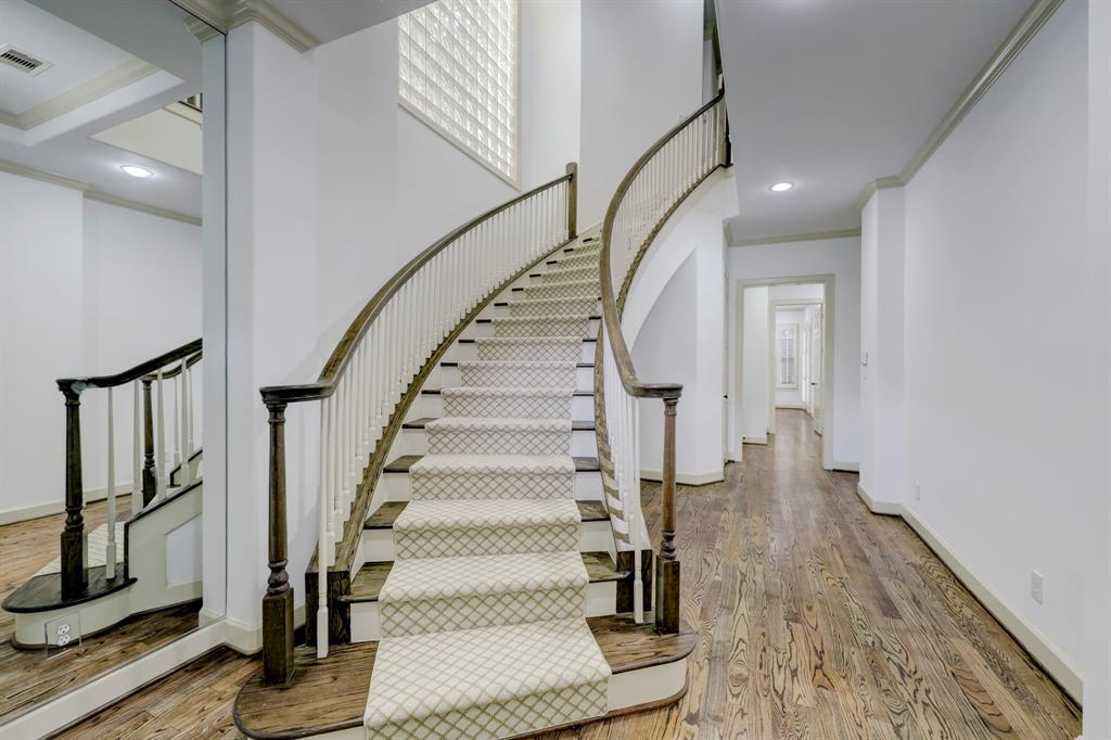 a view of entryway with wooden floor and stairs