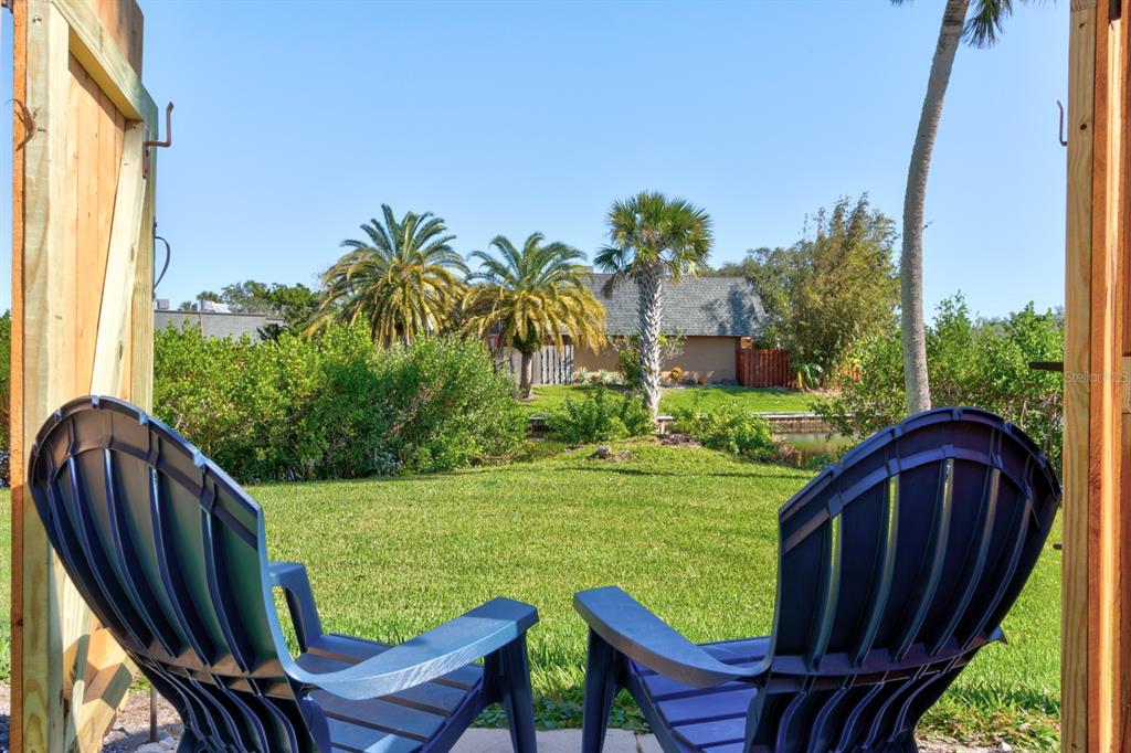 a view of a two chairs in a yard