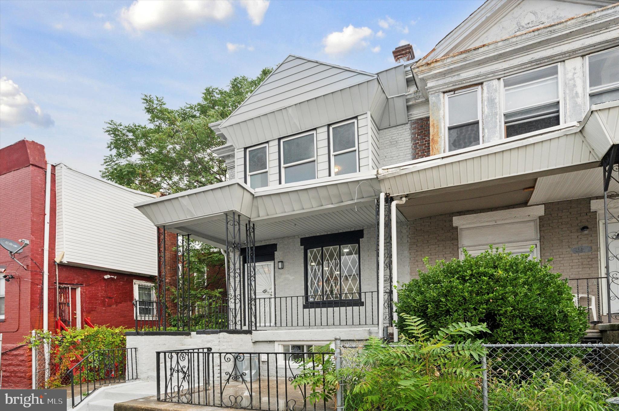 front view of a house with a small yard