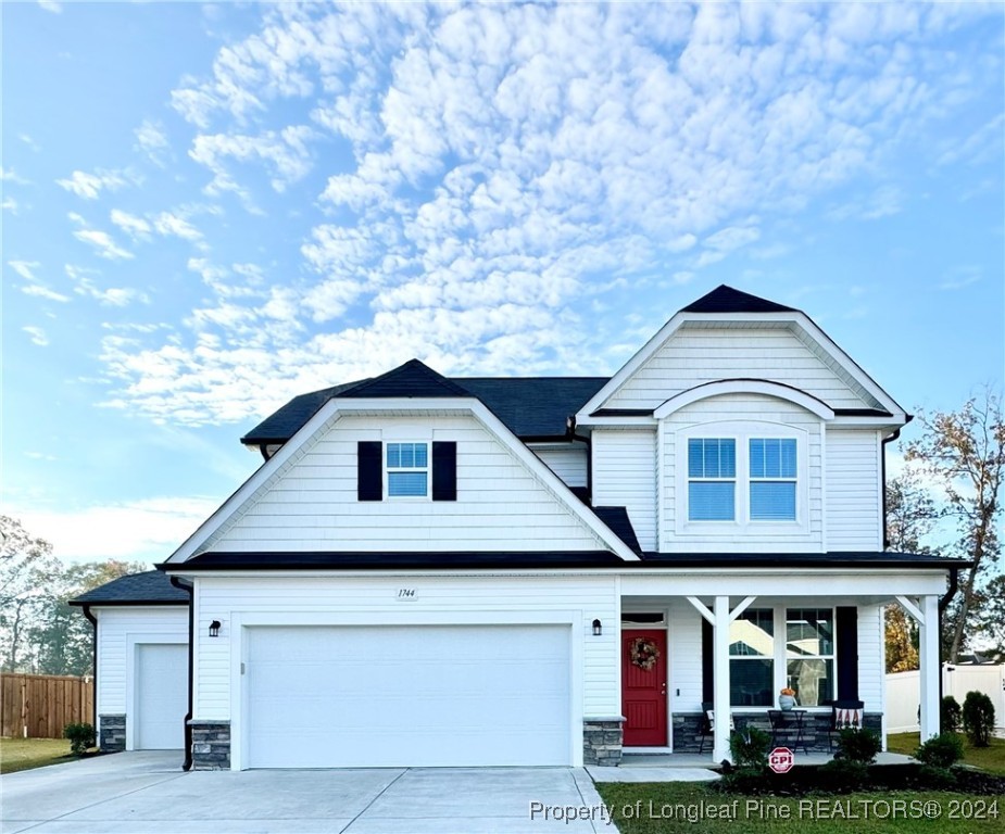 a front view of residential houses with yard