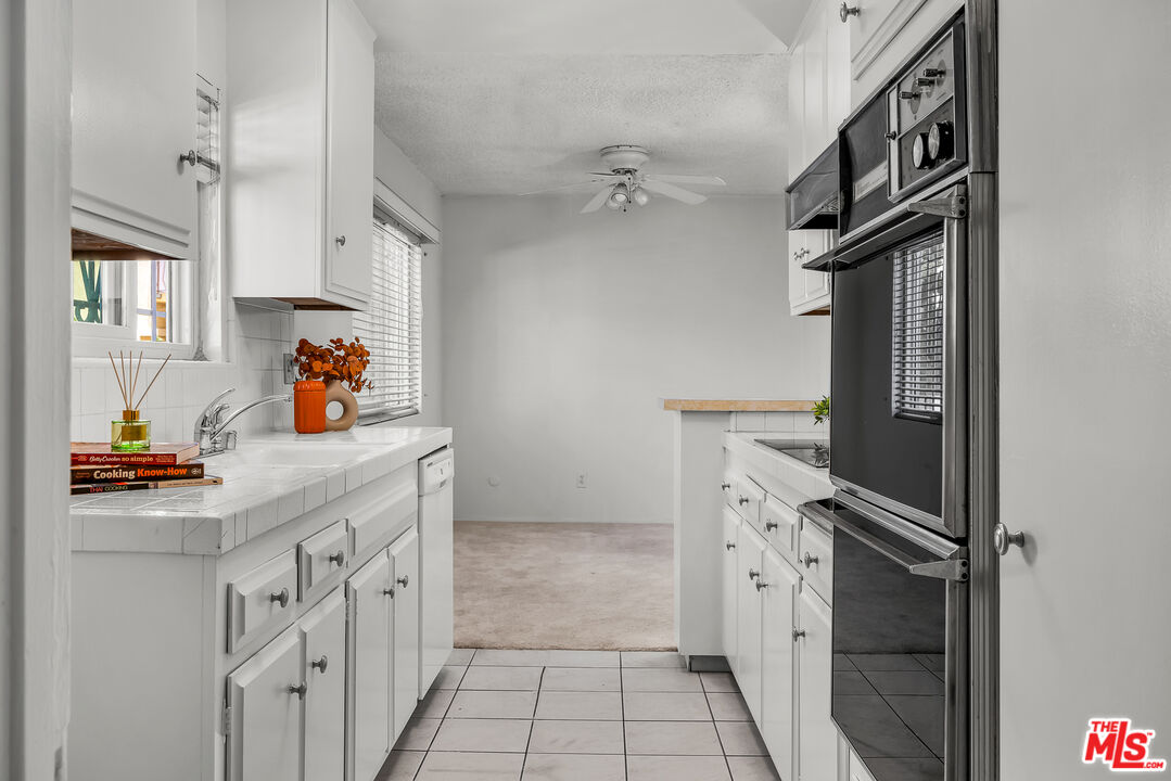 a hallway with cabinets