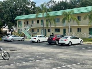 a view of a cars parked in front of a house