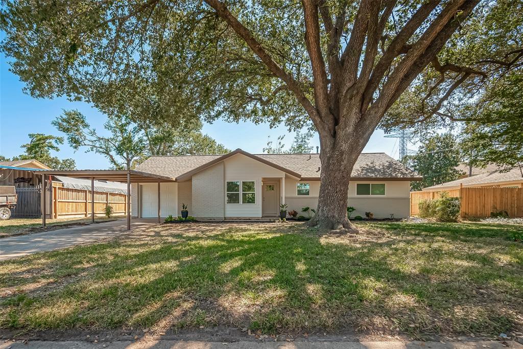 a house with a tree in front of it