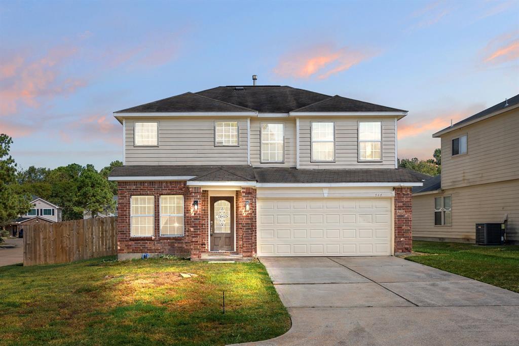 a front view of a house with yard