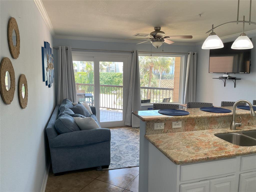 a living room with kitchen island furniture and a large window