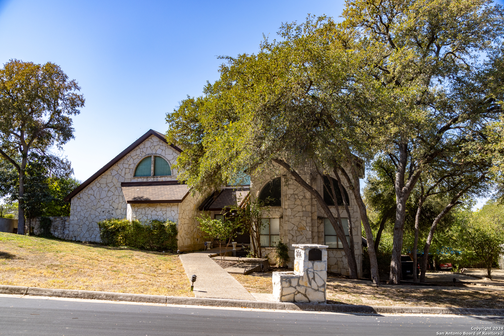 a front view of a house with a yard