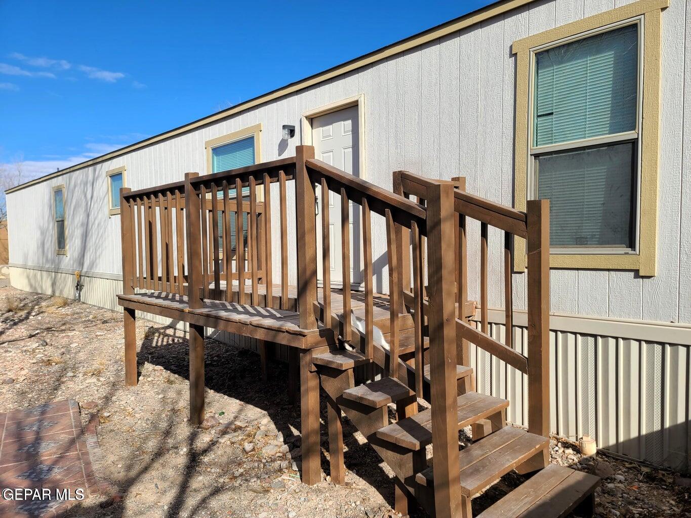 a view of a balcony with chairs