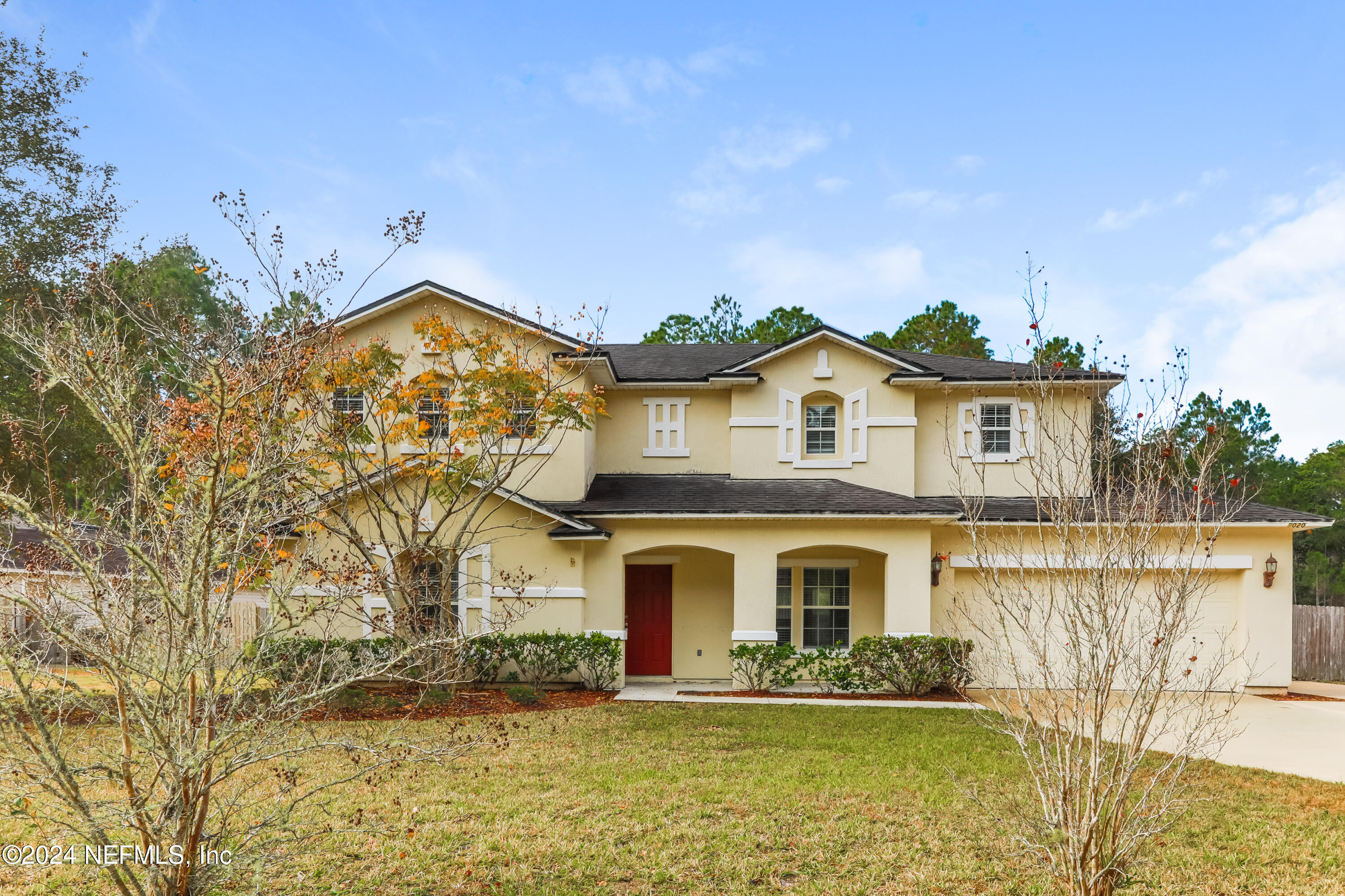 a front view of a house with a yard