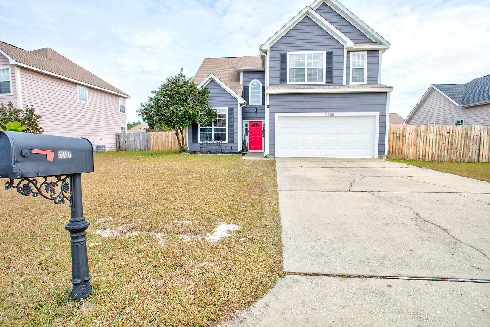 a front view of a house with parking