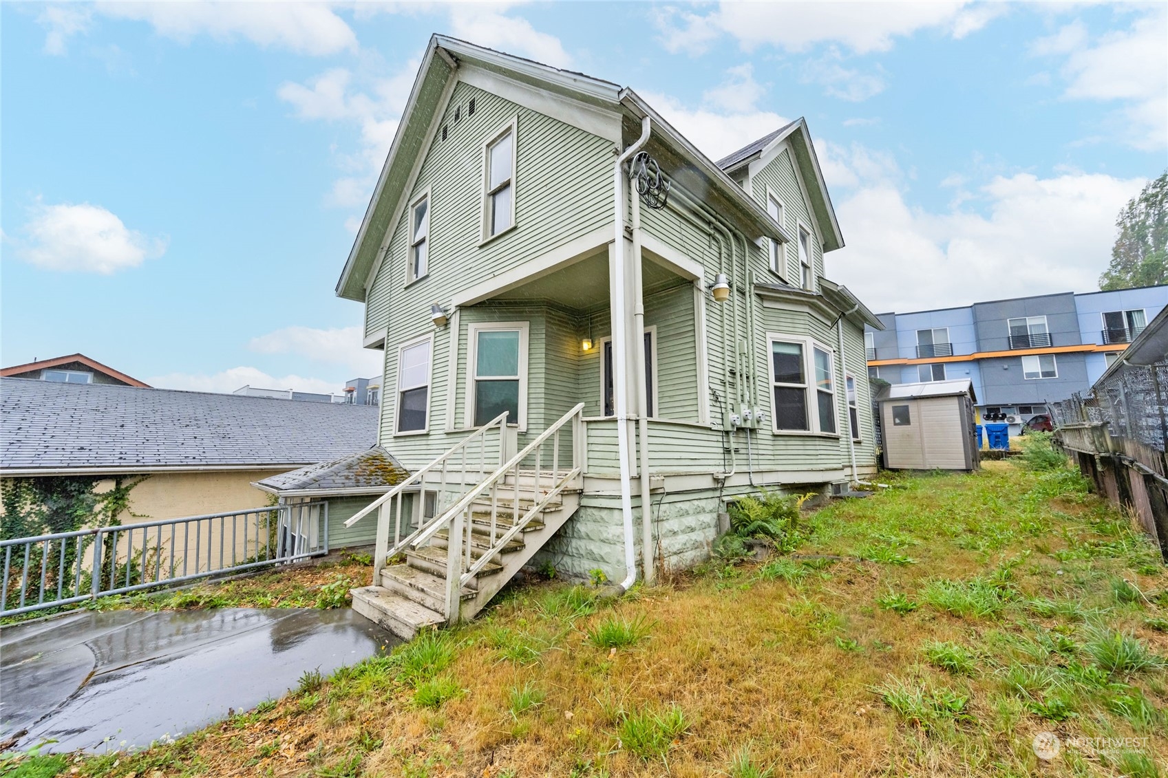 a view of a house with a yard and deck