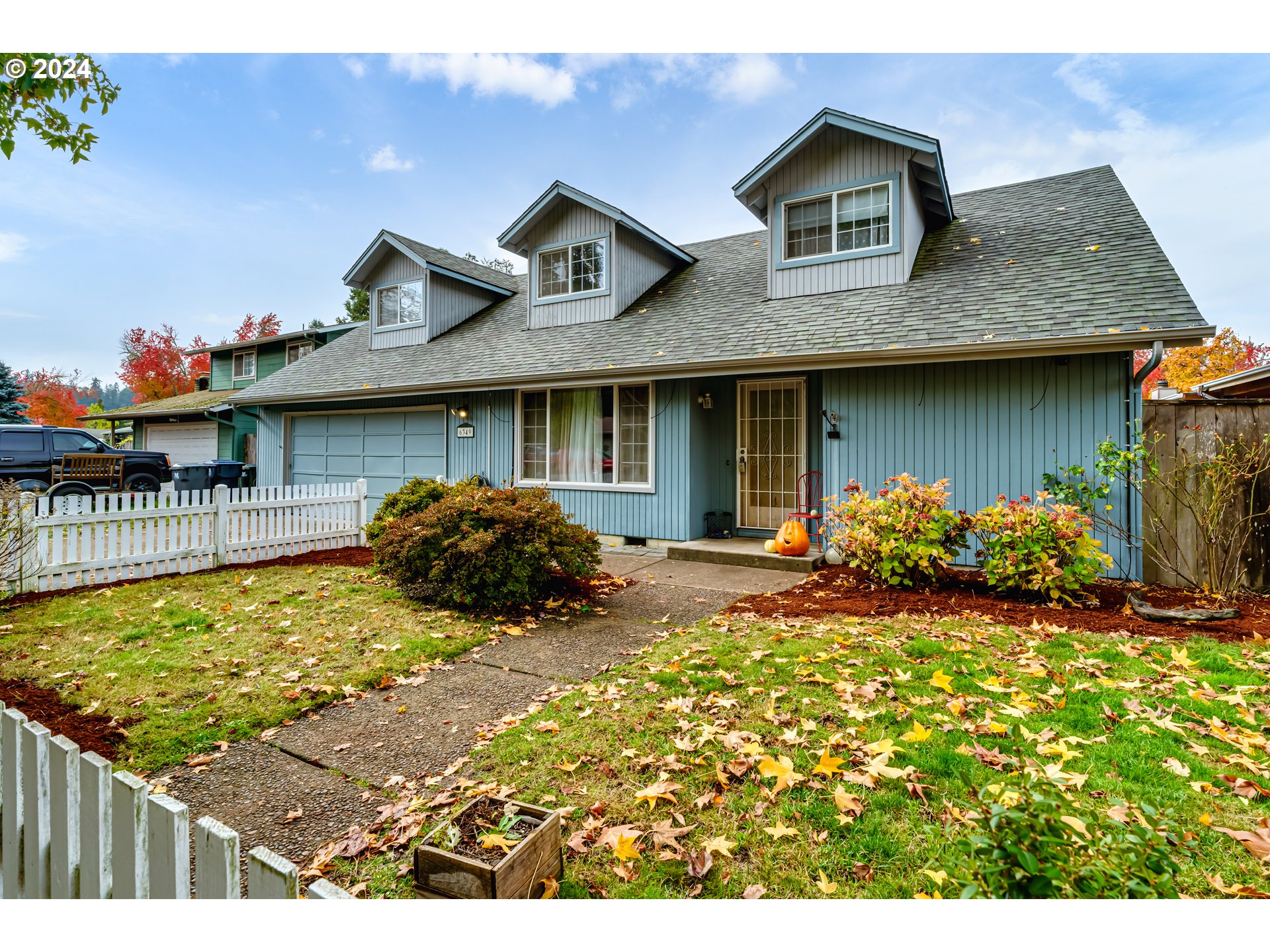 a front view of house with yard and seating space