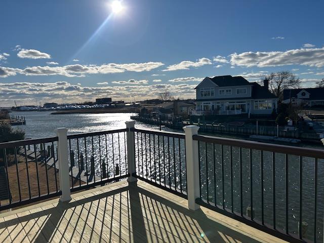 View of dock with a balcony