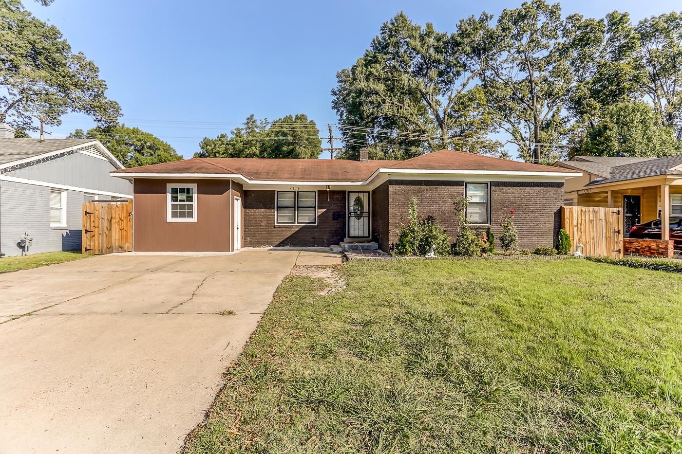 front view of a house with a patio