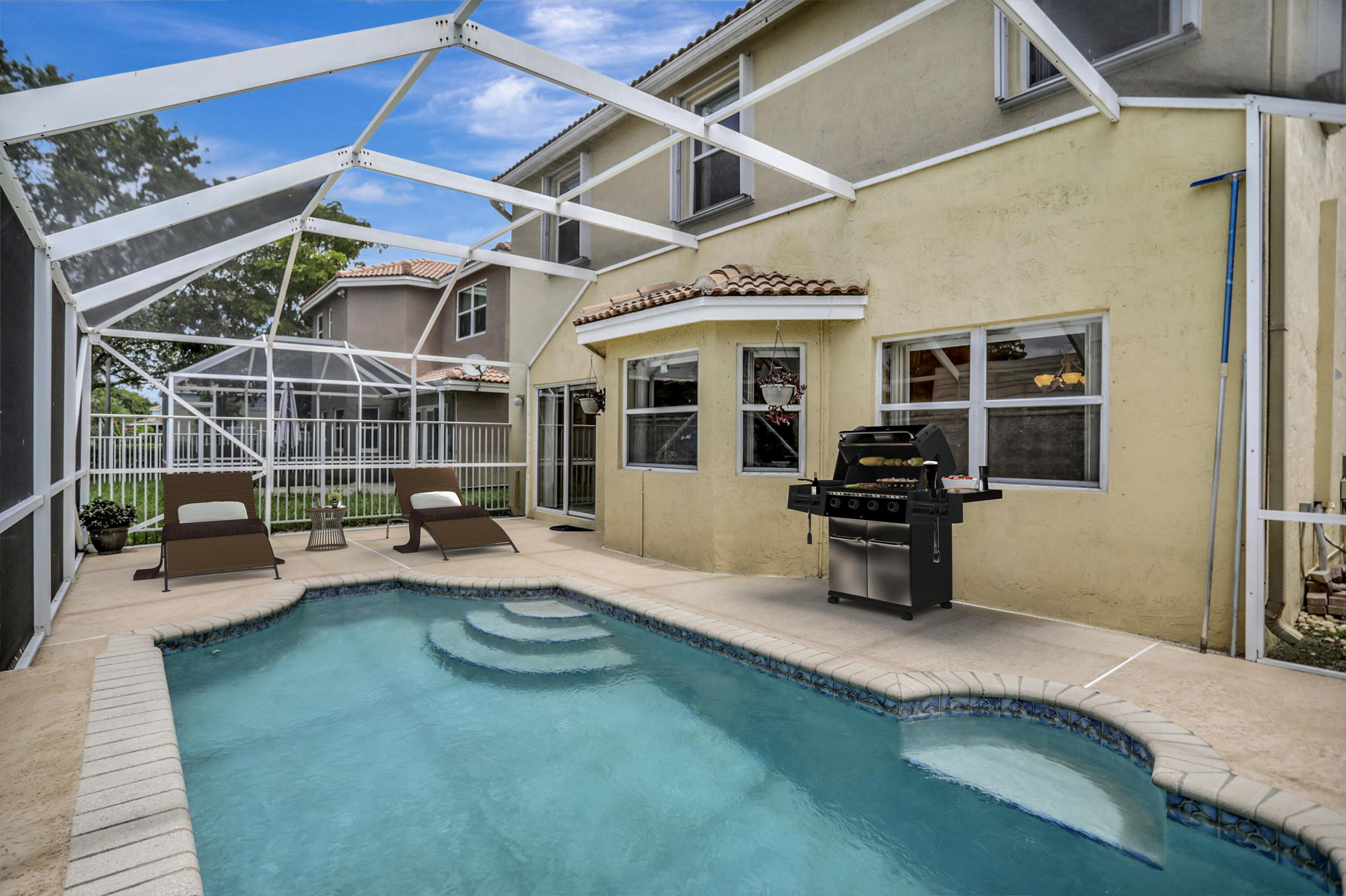 a view of a backyard with sitting area and furniture