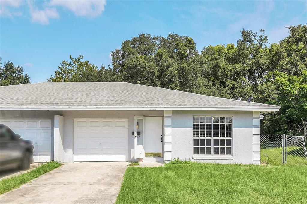 front view of a house with a yard